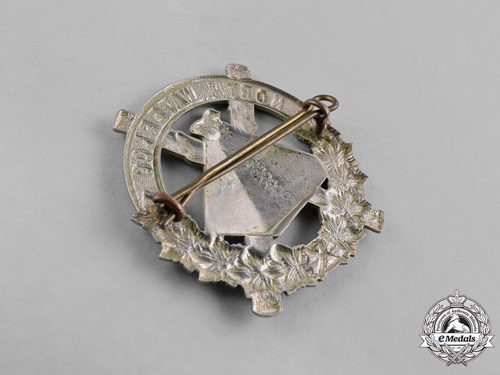 canada._a_lot_of_four_pre-_first_and_second_war_cap_badges_c18-037960
