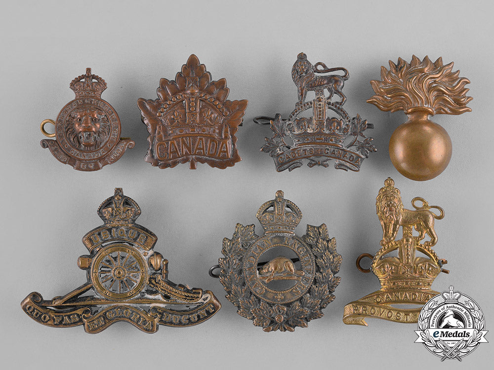 canada._a_lot_of_seven_first_and_second_war_cap_badges_c18-037964