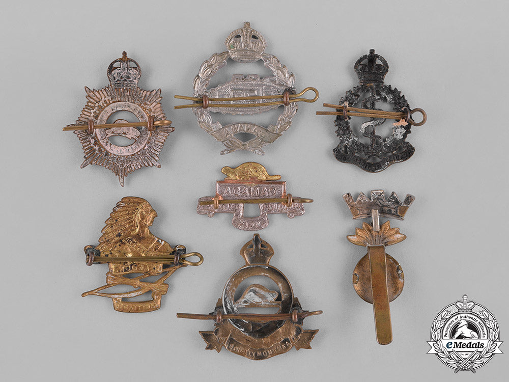 canada._a_lot_of_seven_first_and_second_war_cap_badges_c18-038021