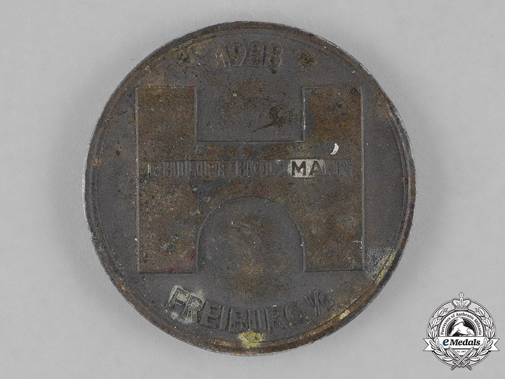 germany._a1938_holzmann_construction_crew_employee_badge_c18-039859