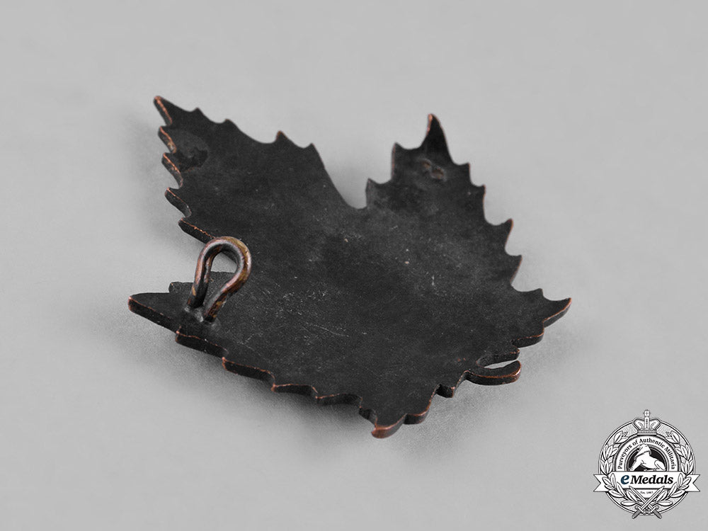 canada._an_eaton_motor_machine_gun_battery_cap_badge&_collar_tab_c18-049973