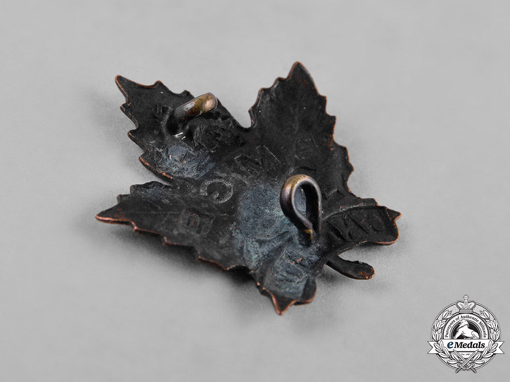 canada._an_eaton_motor_machine_gun_battery_cap_badge&_collar_tab_c18-049974