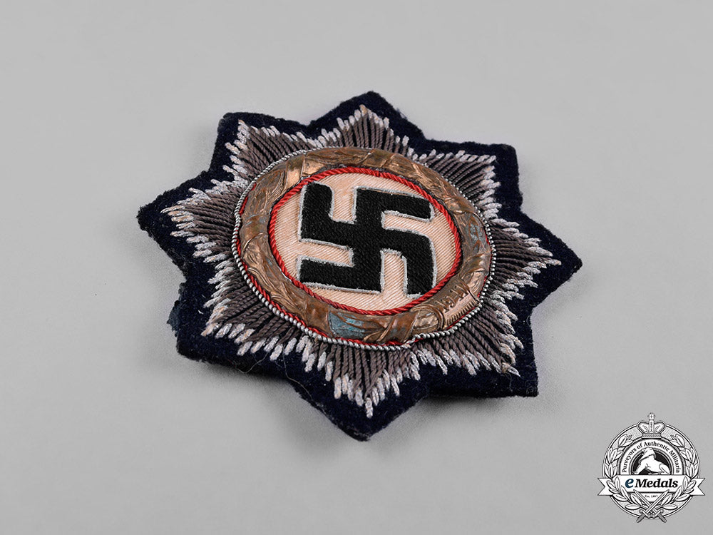 germany,_kriegsmarine._a_german_cross_in_gold,_to_lieutenant-_commander_friedrich_roll_c18-051827_1_1