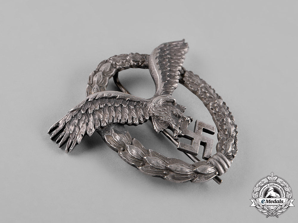 germany,_luftwaffe._an_early_field_repaired_pilot’s_badge,_by_c.e._juncker_c18-051977_1_1_1
