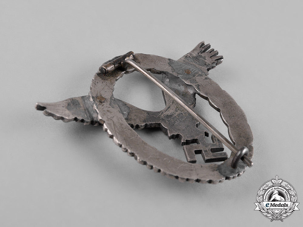 germany,_luftwaffe._an_early_field_repaired_pilot’s_badge,_by_c.e._juncker_c18-051978_1_1_1