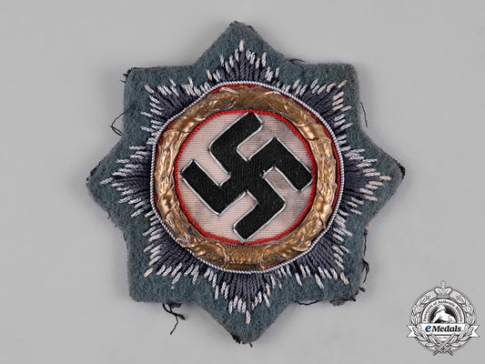 germany,_wehrmacht._a_german_cross_in_gold,_cloth_version,_by_hermann_schmuck&_cie_c18-054826_1