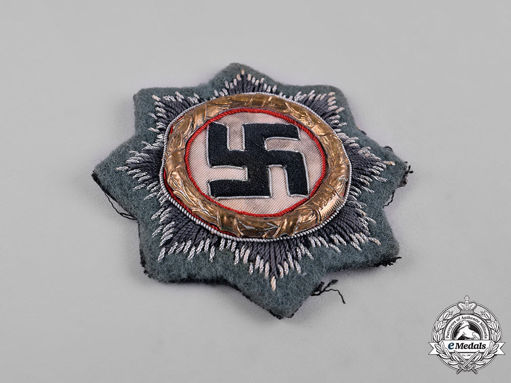 germany,_wehrmacht._a_german_cross_in_gold,_cloth_version,_by_hermann_schmuck&_cie_c18-054828_1