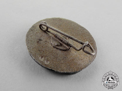 germany._four_first_and_second_war_period_badges,_pins,_and_insignia_c18-1454