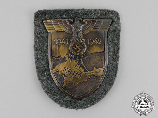 germany._a_mint1942_issue_wehrmacht_heer(_army)_issue_krim_campaign_shield_by_josef_feix_c18-324