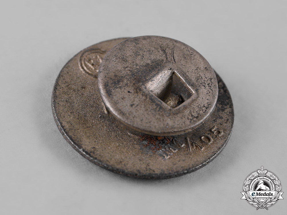 germany,_nsdap._a_party_member’s_buttonhole_badge,_by_hermann_aurich_c19_1422