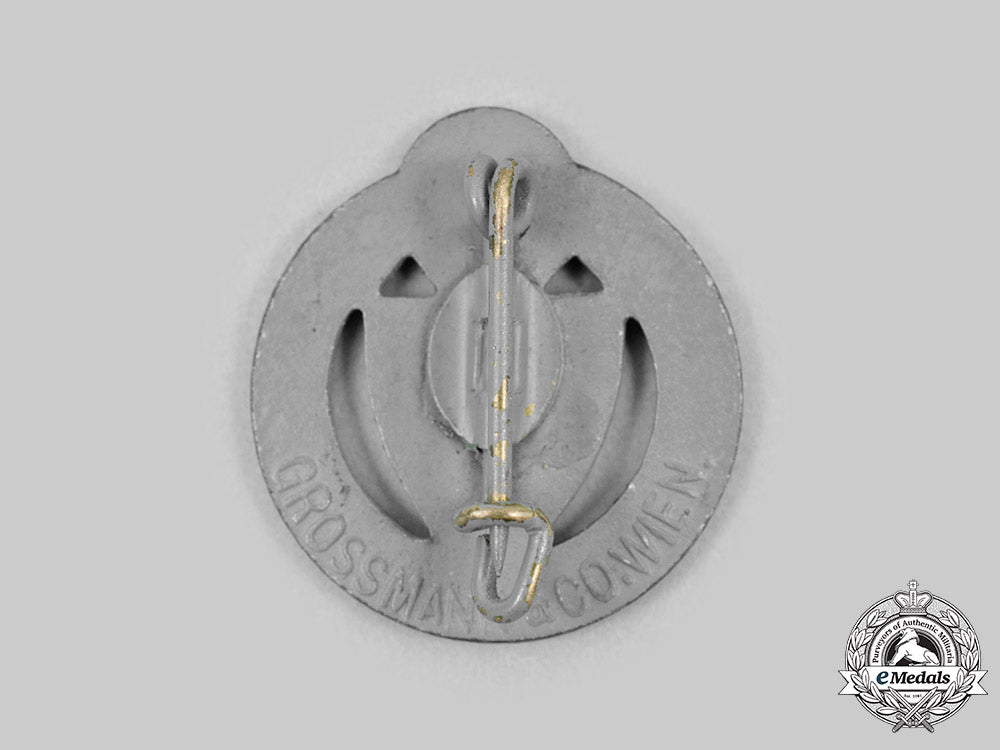 germany,_third_reich._a_styria_people’s_association_membership_badge,_by_grossmann&_co._c20175_mnc5259