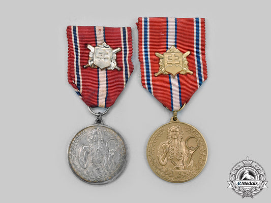 slovakia,_republic._two_commemorative_medals_for_volunteers_in_slovakia_medals1918-1938_c2020_026_mnc1211