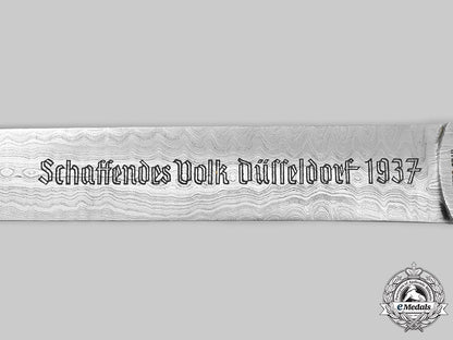 germany,_third_reich._a_reich’s_exhibition_of_productive_people_damascus_blade_letter_opener,_by_gebrüder_grah_c2020_068_mnc2842_1_1_1