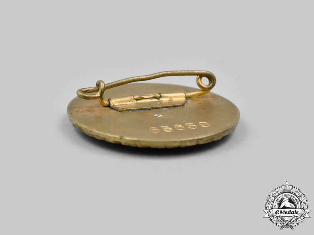 germany,_nsdap._a_pair_of_golden_parties_badges_c2020_081_mnc0730