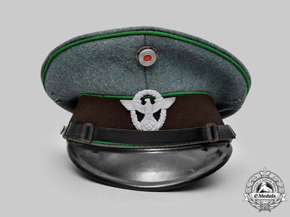 germany,_schutzpolizei._an_em/_nco’s_visor_cap,_by_carl_isken_c2020_151_mnc7971