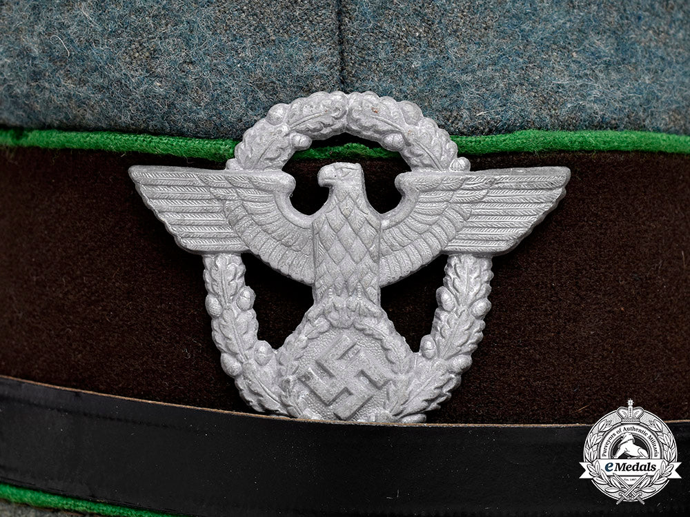 germany,_schutzpolizei._an_em/_nco’s_visor_cap,_by_carl_isken_c2020_156_mnc7981