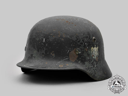 germany,_heer._a_battle-_damaged_heer_m40_steel_helmet_c2020_472_mnc9349_1_1_1_1_1