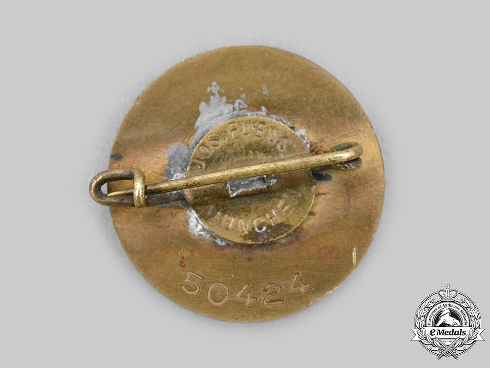 germany,_nsdap._a_golden_party_badge,_small_version,_by_josef_fuess_c2020_979_mnc4025_1_1