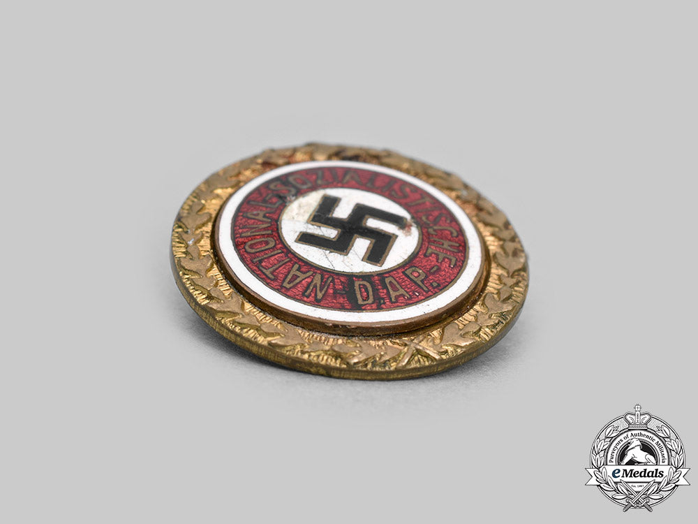 germany,_nsdap._a_golden_party_badge,_small_version,_by_josef_fuess_c2020_980_mnc4027_1_1