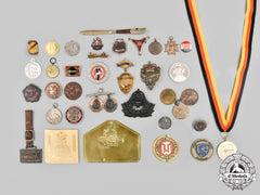 International. A Lot Of Thirty-Nine Medals, Badges, And Insignia