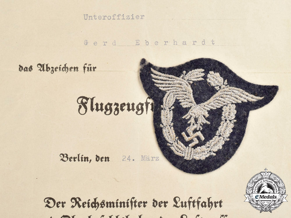 germany,_luftwaffe._a_pilot’s_badge,_cloth_version_with_document,_to_unteroffizier_gerd_eberhardt_c2021_249_mnc9364_1