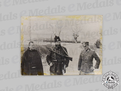 yugoslavia,_serbia._a_chetnik_soldier_with_a_catholic_priest_and_a_german_officer_photograph,_c.1943_c2021_552emd_8042_1