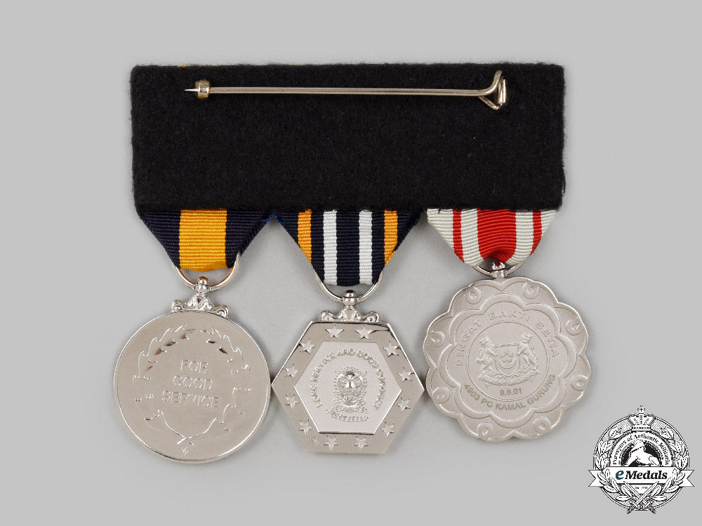 singapore,_republic._a_group_of_three_to_gurkha_police_constable,_singapore_police_force_c2021_641emd_8255