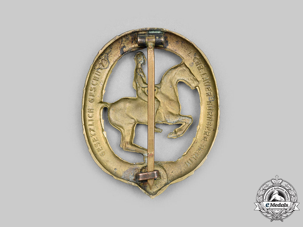 germany,_third_reich._a_german_equestrian_badge,_iii_class_in_bronze,_by_l._christian_lauer_c2021_748_mnc6617