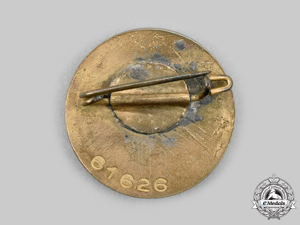 germany,_nsdap._a_golden_party_badge,_small_version,_by_josef_fuess_c20258_mnc8367_1