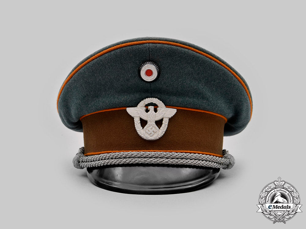 germany,_ordnungspolizei._a_gendarmerie_officer’s_visor_cap,_by_willy_sprengpfeil_c20802_mnc2396