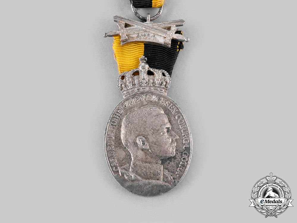 saxe-_coburg&_gotha,_duchy._a_duke_carl_eduard_medal_with_war_decoration_c20997_emd0066_1