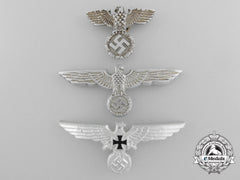 A Lot Of Three German Eagle Cap Badges