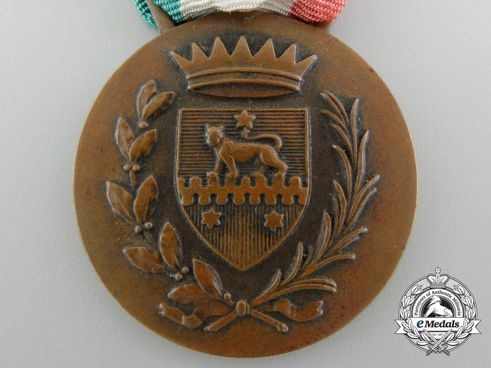 an_italian_medal_for_financial_advisor_to_somalia1950_bronze,32_mm,_original_ribbon,_oxidation_spots_on_the_reverse,_light_contact,_very_fine._c_3551