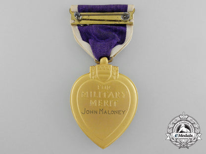 a_purple_heart_to_john_maloney_who_was_killed_in_action_during_a_kamikaze_attack_c_3884