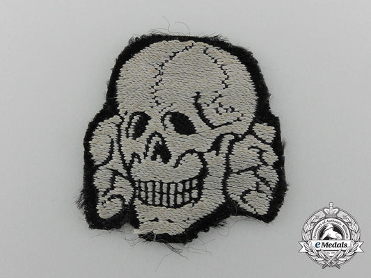 a_totenkopf_skull;_removed_from_waffen-_ss_cap_c_4429