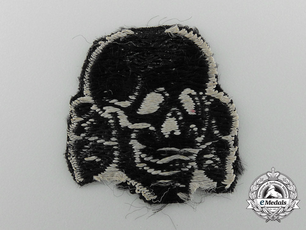 a_totenkopf_skull;_removed_from_waffen-_ss_cap_c_4430