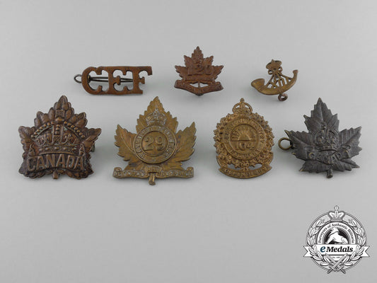 a_lot_of_seven_royal_canadian_military_cap_badges_and_uniform_insignia_c_5296