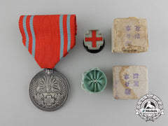 A Japanese Red Cross Society Life Membership Medal With Matching Buttonhole Rosette