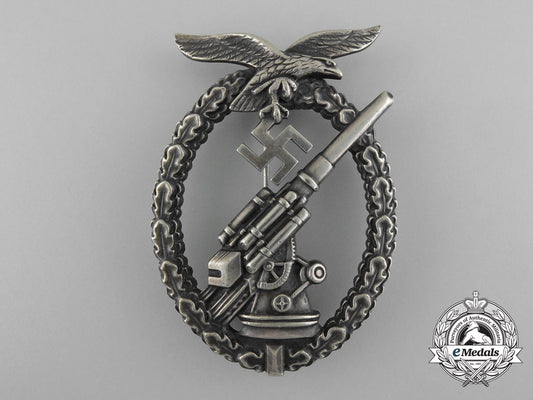 an_early_luftwaffe_flak_badge_in_tombac_with_ball_hinge_c_7352