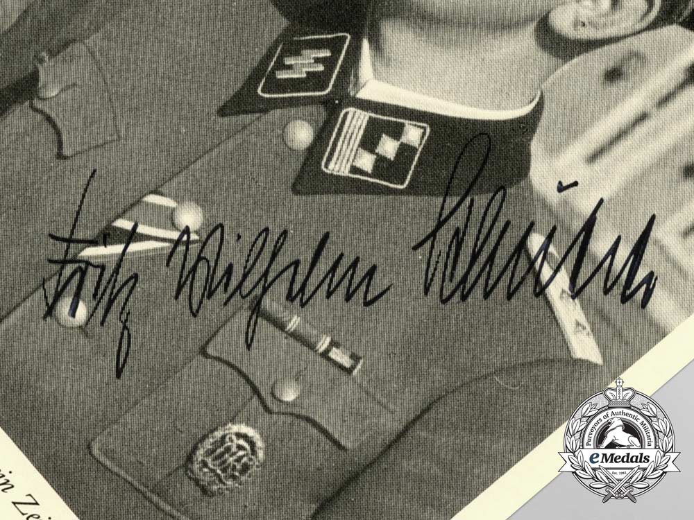 a_signed_photograph_of_fritz_schütter_with_an_advert_for_his_book“_men_of_the_waffen-_ss”_c_8386
