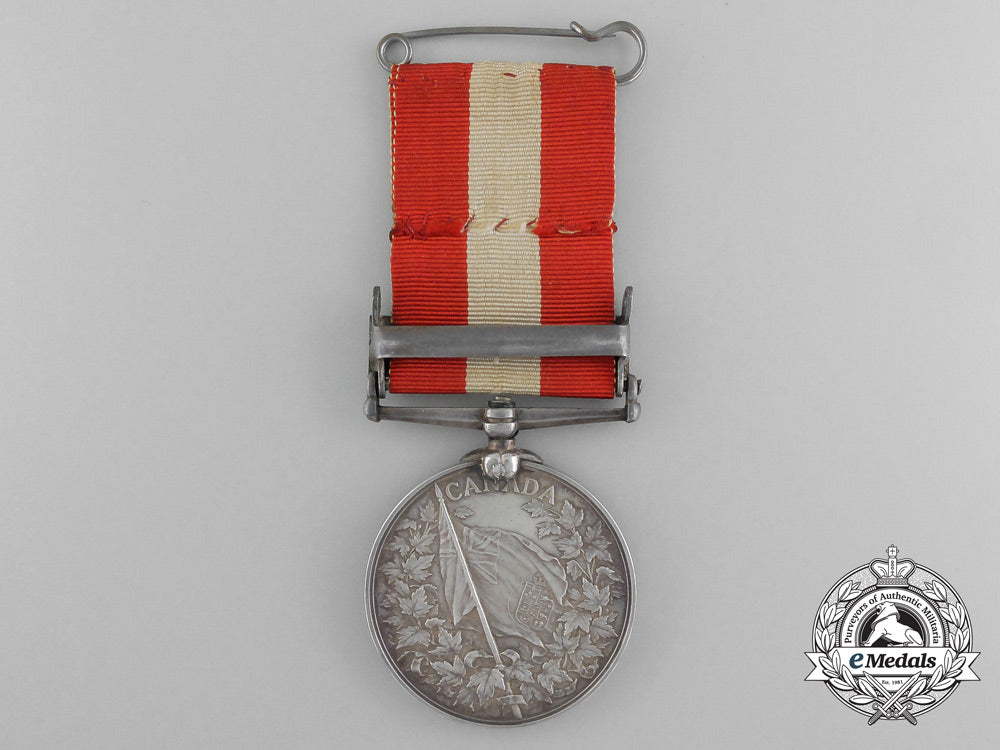 a_canada_general_service_medal_with_miniature,_photograph_of_recipient,&_carton_c_9557