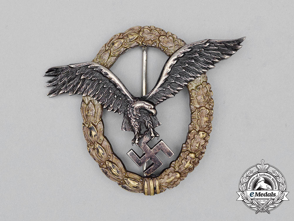 a_fine_early_quality_manufacture_luftwaffe_pilot’s_badge_by_c._e._juncker_of_berlin;_j-1_type_cc_0563