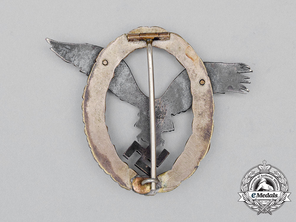 a_fine_early_quality_manufacture_luftwaffe_pilot’s_badge_by_c._e._juncker_of_berlin;_j-1_type_cc_0564