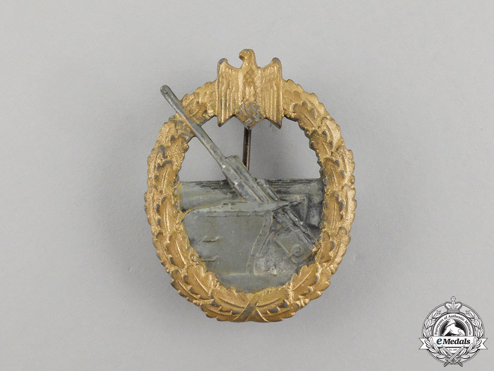 germany,_kriegsmarine._a_coastal_artillery_war_badge_by_sohni&_heubach_in_packet_of_issue_cc_1205