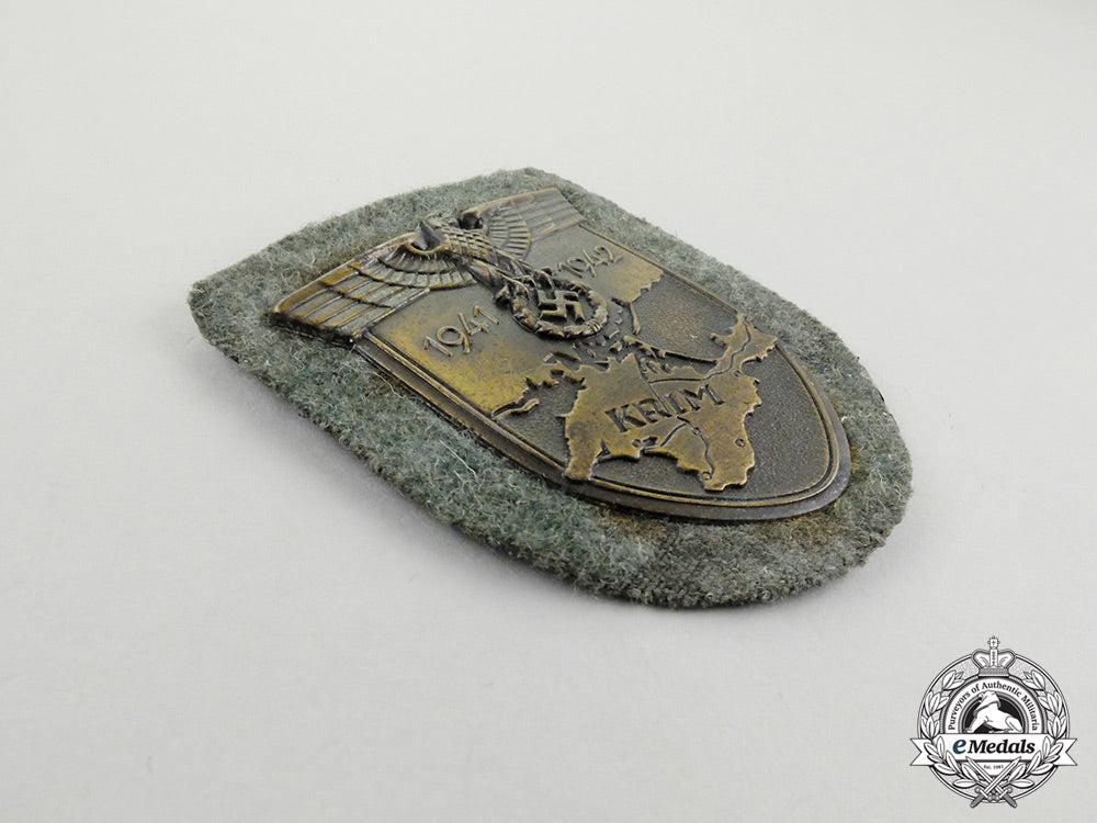 a_wehrmacht_heer(_army)_issue_krim_campaign_shield_by_josef_feix&_söhne;_dated_cc_2967