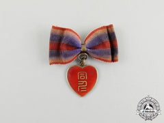 A Second War Chinese Qing Bao Xing Badge For Japanese Women