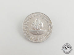 A 1935/36 “The Führer Calls To The Whw” (Winter Relief Of The German People) Badge
