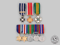 Canada, Rhodesia, International. A Lot Of Eight Miniature Medals