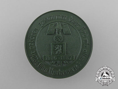germany._a1937_winter_relief_of_the_german_people“_we_belong_together;_then_we_are_one”_badge_d_0116_1