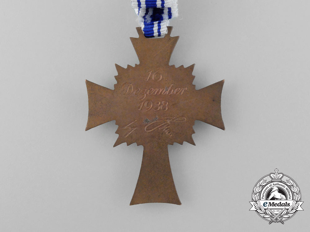 a_bronze_grade_mother’s_cross_with_original_packet_of_issue_d_0213